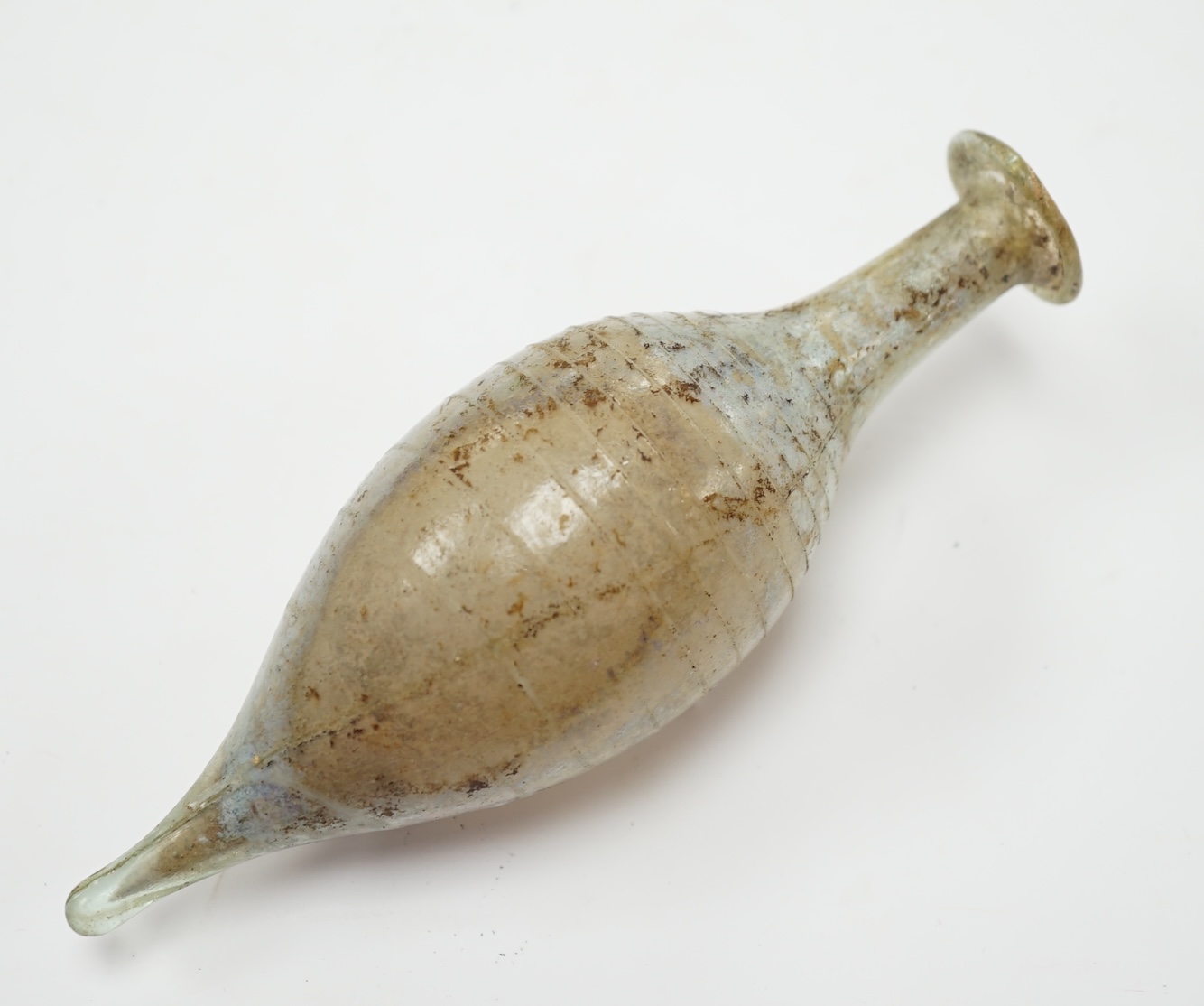 A Roman glass unguentarium, with trailed decoration, 14cm. Condition - poor, has a vertical crack from top to bottom
